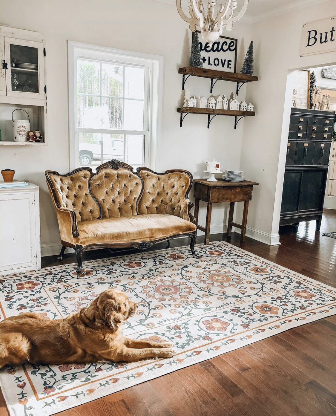 The kitchen nook with an antique settee.