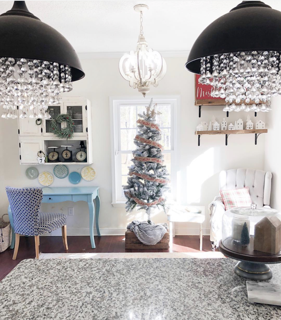 This shows the kitchen nook with a desk and chair.
